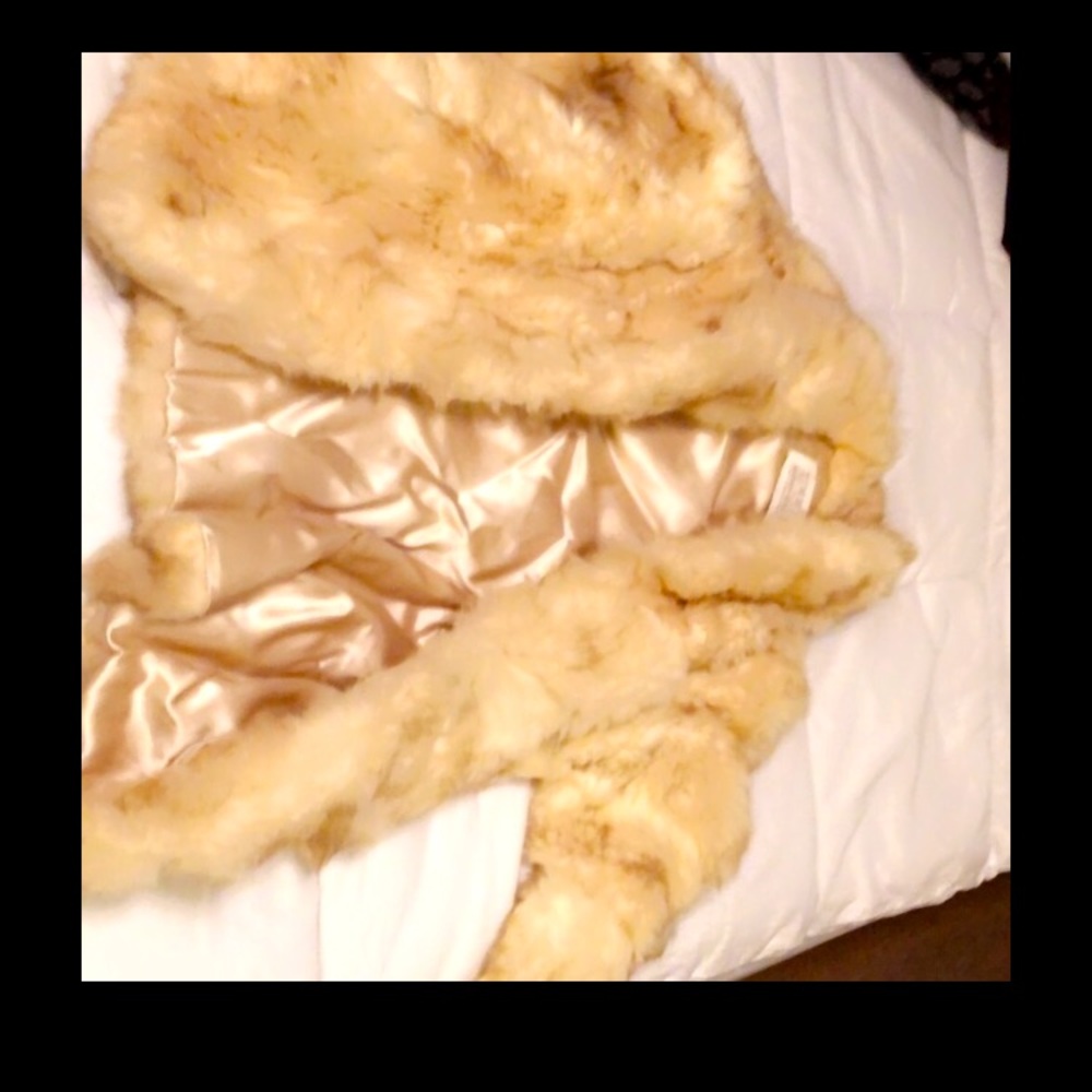 Authentic fur coat cream colored with light tan silk inside